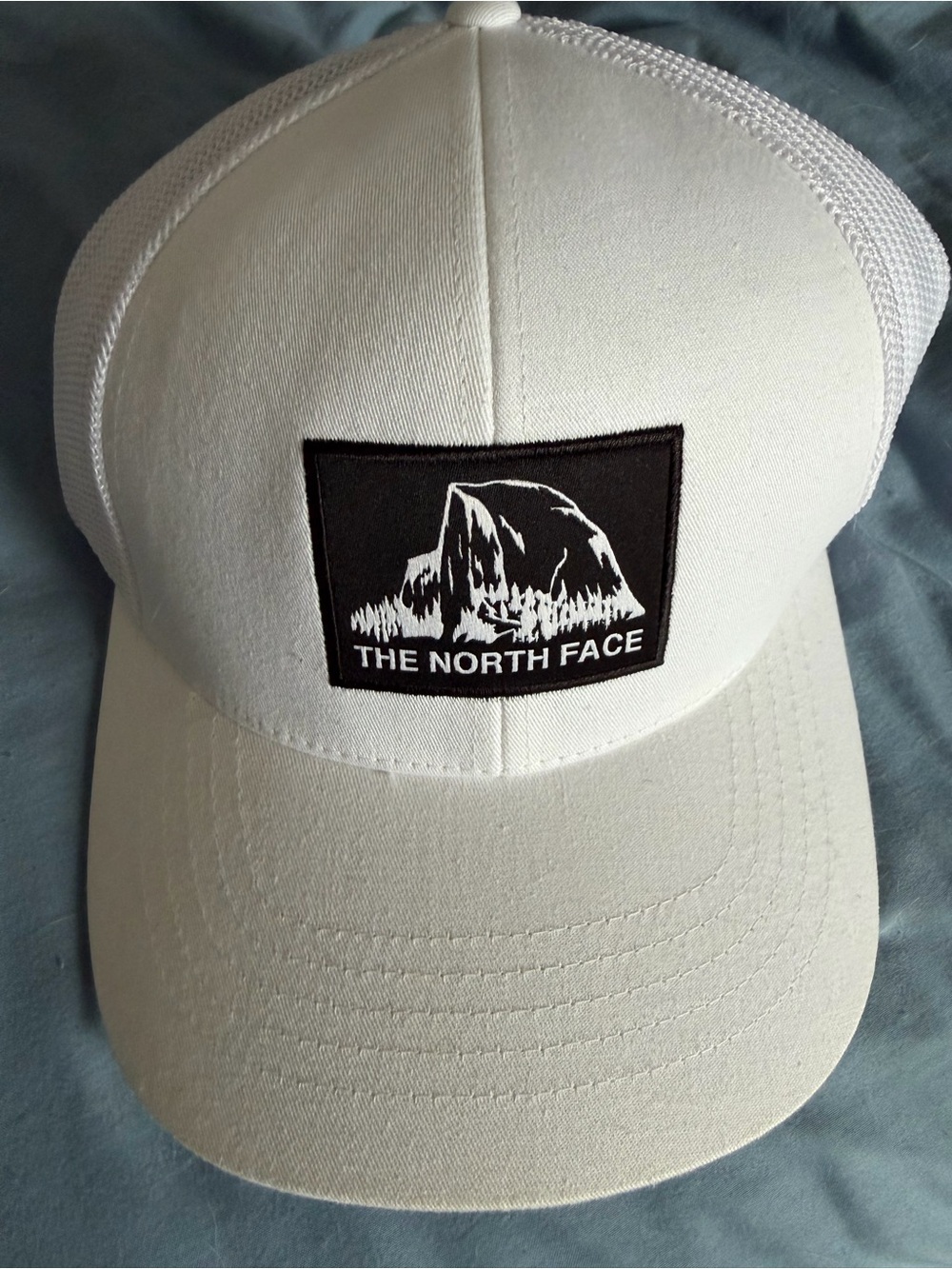 The North Face White Flexfit Cap with Mesh Interior